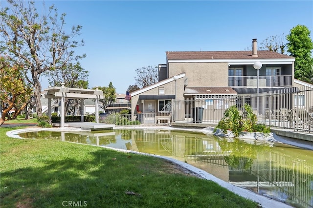 2827 S Fairview St Unit O, Santa Ana, CA 92704 - rear view of property featuring a balcony and stucco siding