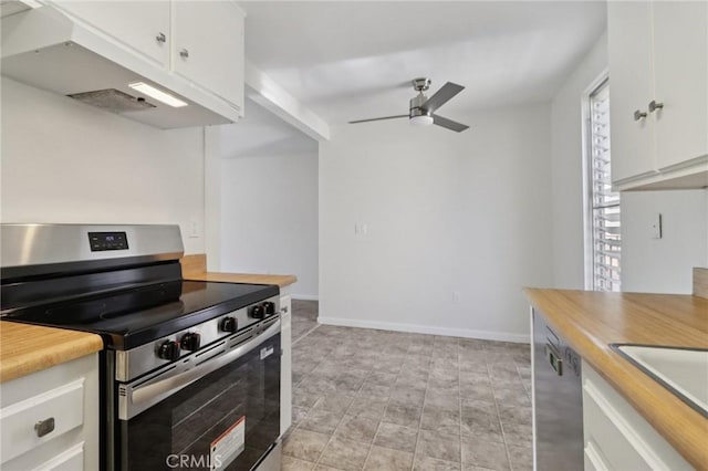 1010 W Macarthur Blvd Unit 24, Santa Ana, CA 92707 - kitchen with stainless steel appliances, under cabinet range hood, ceiling fan, white cabinetry, and butcher block countertops