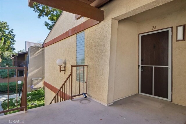 1010 W Macarthur Blvd Unit 24, Santa Ana, CA 92707 - entrance to property with a patio area and stucco siding