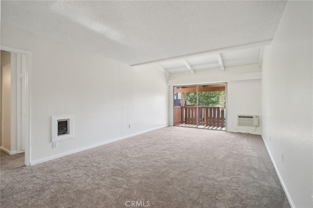 1010 W Macarthur Blvd Unit 24, Santa Ana, CA 92707 - carpeted empty room with beamed ceiling, heating unit, and a textured ceiling