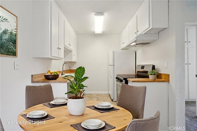 1010 W Macarthur Blvd Unit 24, Santa Ana, CA 92707 - dining room with baseboards