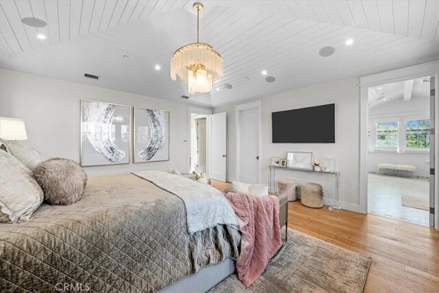 910 28th St, Manhattan Beach, CA 90266 - bedroom with wood finished floors, wooden ceiling, a chandelier, and recessed lighting