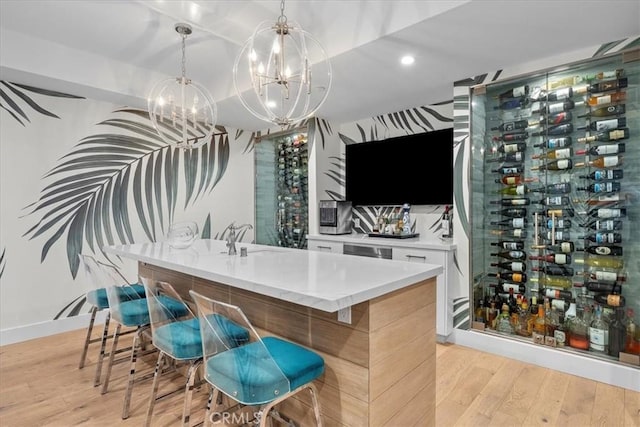 910 28th St, Manhattan Beach, CA 90266 - indoor bar featuring light wood finished floors, a chandelier, pendant lighting, and recessed lighting