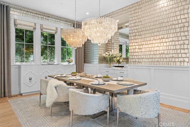 910 28th St, Manhattan Beach, CA 90266 - dining space with a chandelier, a decorative wall, light wood-type flooring, a wainscoted wall, and recessed lighting