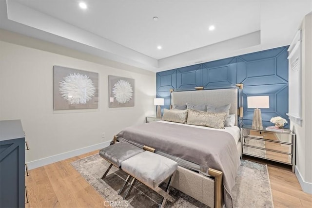 910 28th St, Manhattan Beach, CA 90266 - bedroom featuring a raised ceiling, light wood-style flooring, and recessed lighting