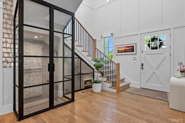 910 28th St, Manhattan Beach, CA 90266 - foyer entrance featuring wood finished floors, stairway, french doors, and a high ceiling