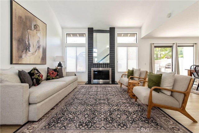 18076 Courreges Ct, Fountain Valley, CA 92708 - living room with a fireplace and wood finished floors