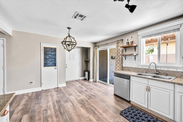 5616 Cahuilla Ave Unit 29, Palms, CA 92277 - kitchen with dishwasher, light wood finished floors, white cabinets, and open shelves