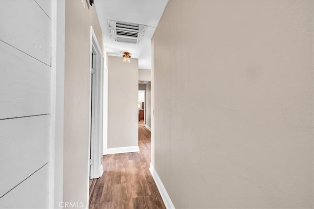 5616 Cahuilla Ave Unit 29, Palms, CA 92277 - hall with wood finished floors and baseboards