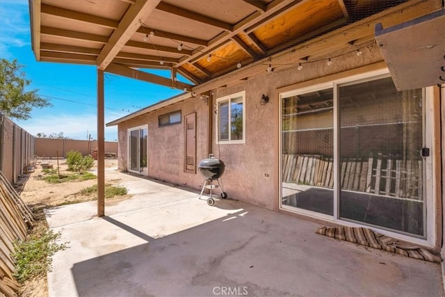 5616 Cahuilla Ave Unit 29, Palms, CA 92277 - fenced backyard with a patio area and a grill