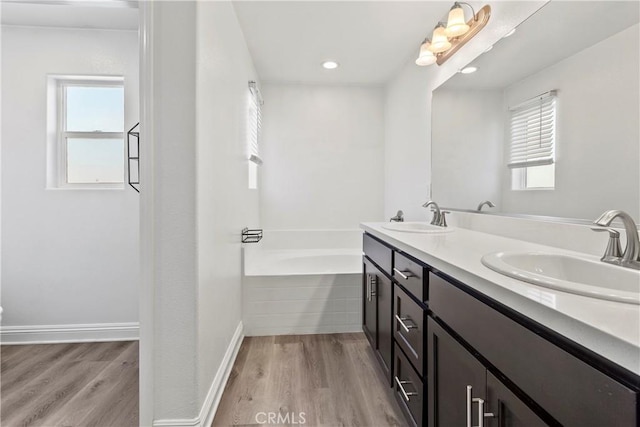 4429 La Joya Dr, Guadalupe, CA 93434 - full bath with wood finished floors, a garden tub, double vanity, and recessed lighting