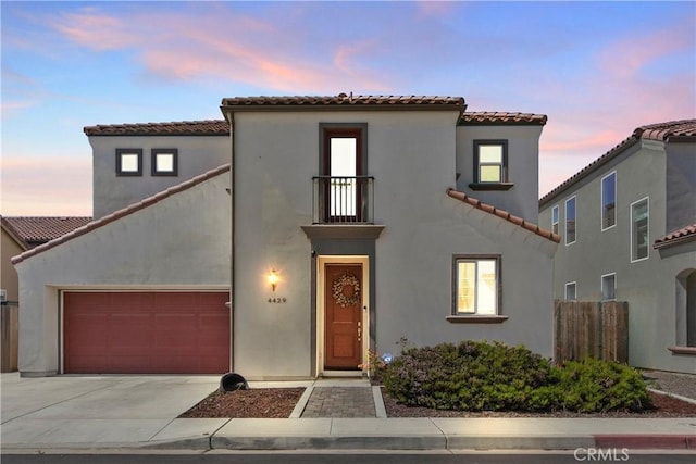 4429 La Joya Dr, Guadalupe, CA 93434 - mediterranean / spanish-style house with a tile roof, a balcony, driveway, and stucco siding