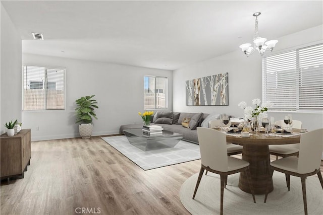 4429 La Joya Dr, Guadalupe, CA 93434 - dining area featuring light wood-style flooring and a chandelier