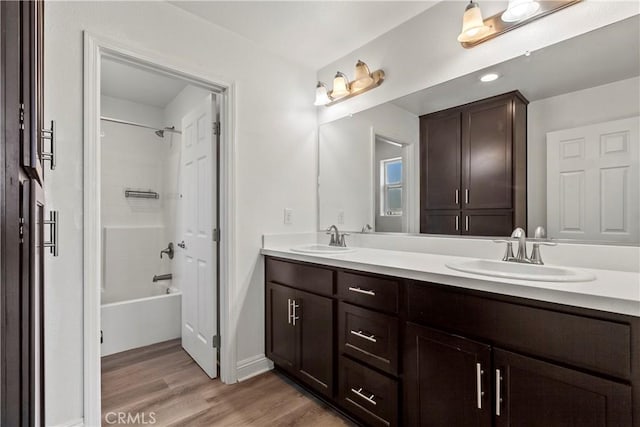 4429 La Joya Dr, Guadalupe, CA 93434 - bathroom with double vanity, wood finished floors, and shower / tub combination
