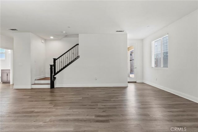 4429 La Joya Dr, Guadalupe, CA 93434 - unfurnished living room with stairway, wood finished floors, and recessed lighting