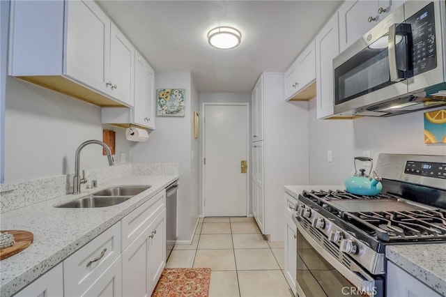 4863 Jackson St Unit B, Riverside, CA 92503 - kitchen featuring stainless steel appliances, white cabinetry, light stone counters, and light tile patterned floors