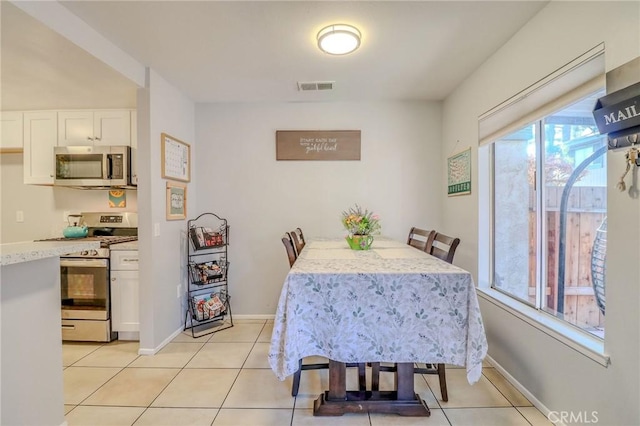4863 Jackson St Unit B, Riverside, CA 92503 - dining space featuring light tile patterned floors and baseboards