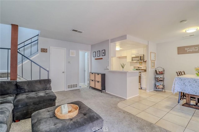 4863 Jackson St Unit B, Riverside, CA 92503 - living area with stairway and light colored carpet