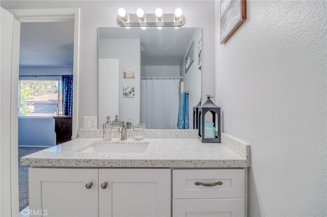 4863 Jackson St Unit B, Riverside, CA 92503 - bathroom with vanity and a textured wall
