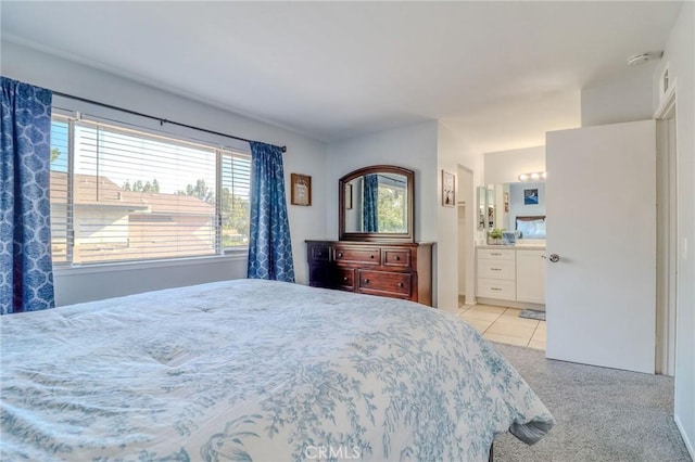 4863 Jackson St Unit B, Riverside, CA 92503 - bedroom featuring connected bathroom, light tile patterned floors, and light colored carpet