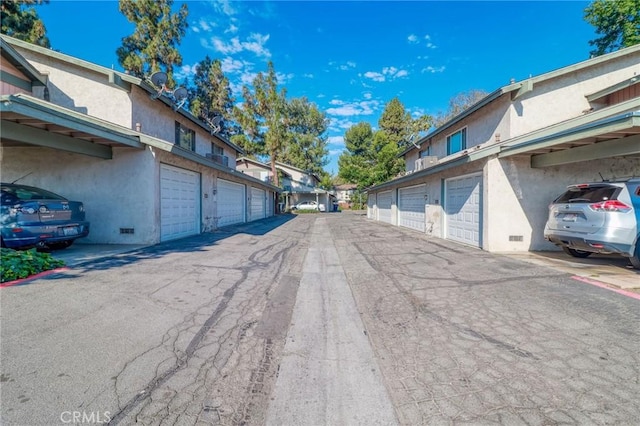 4863 Jackson St Unit B, Riverside, CA 92503 - view of asphalt road featuring community garages and a residential view