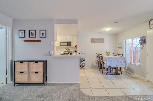 4863 Jackson St Unit B, Riverside, CA 92503 - dining space with baseboards and light tile patterned flooring