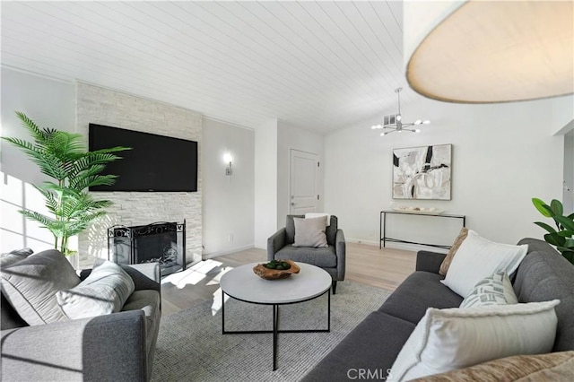 26342 Via Conchita, Mission Viejo, CA 92691 - living area featuring light wood finished floors, a chandelier, a fireplace, and lofted ceiling