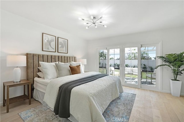 26342 Via Conchita, Mission Viejo, CA 92691 - bedroom featuring access to outside, light wood-style flooring, and a chandelier
