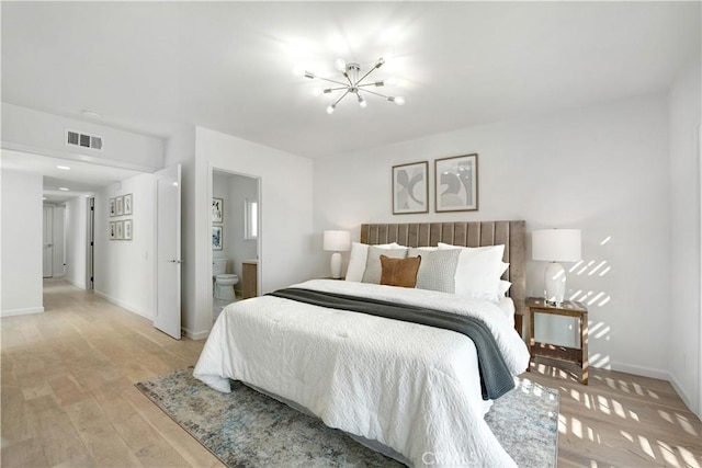 26342 Via Conchita, Mission Viejo, CA 92691 - bedroom featuring a chandelier, light wood-style floors, and ensuite bath
