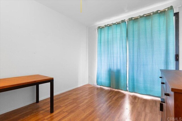 2224 River Run Dr Unit 154, San Diego, CA 92108 - spare room with wood finished floors and baseboards