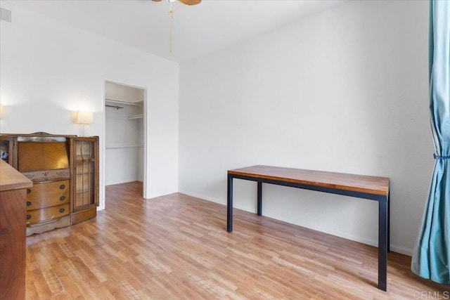 2224 River Run Dr Unit 154, San Diego, CA 92108 - unfurnished bedroom with light wood-style flooring, a spacious closet, and ceiling fan