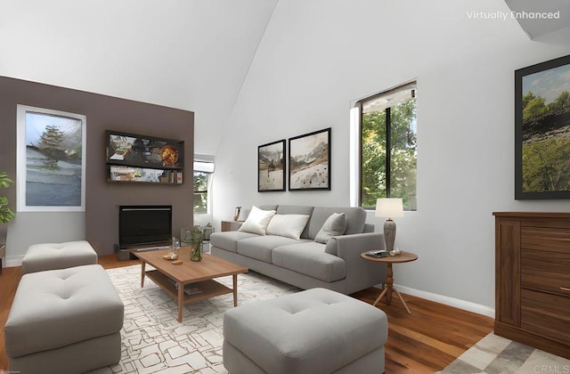 2224 River Run Dr Unit 154, San Diego, CA 92108 - living room featuring light wood-type flooring and a towering ceiling