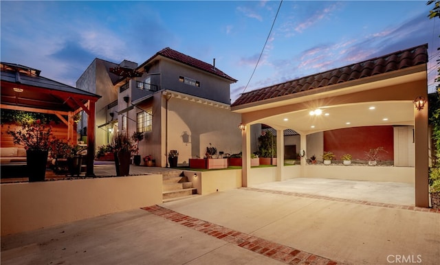 4022 Willowcrest Ave, Studio City, CA 91604 - back of property featuring a tiled roof, a gazebo, and stucco siding
