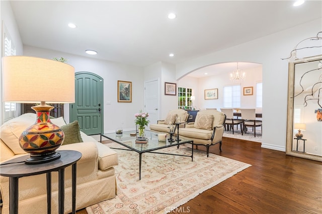 4022 Willowcrest Ave, Studio City, CA 91604 - living area with arched walkways, recessed lighting, dark wood-style floors, and a chandelier