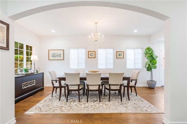 4022 Willowcrest Ave, Studio City, CA 91604 - dining room with arched walkways, a chandelier, dark wood-type flooring, and recessed lighting