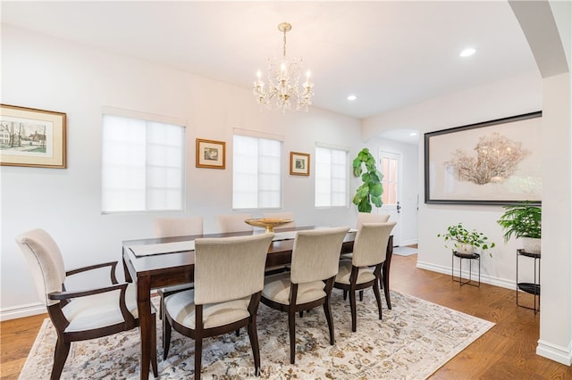 4022 Willowcrest Ave, Studio City, CA 91604 - dining area featuring arched walkways, wood finished floors, a chandelier, and recessed lighting