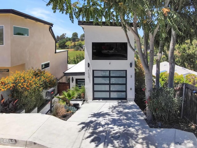 4255 Raynol St, Los Angeles, CA 90032 - modern home featuring stucco siding and driveway