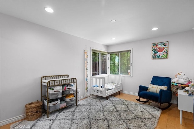 17172 Lahey St, Granada Hills, CA 91344 - bedroom featuring wood finished floors, recessed lighting, and a nursery area