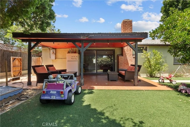 17172 Lahey St, Granada Hills, CA 91344 - back of house with a chimney, a patio, an outdoor living space, and stucco siding