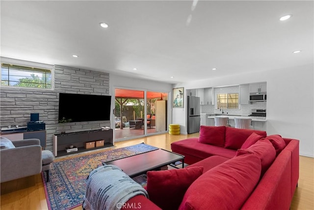 17172 Lahey St, Granada Hills, CA 91344 - living area featuring healthy amount of natural light, recessed lighting, and light wood-style flooring
