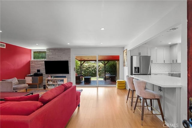 17172 Lahey St, Granada Hills, CA 91344 - living room with light wood-style flooring and recessed lighting