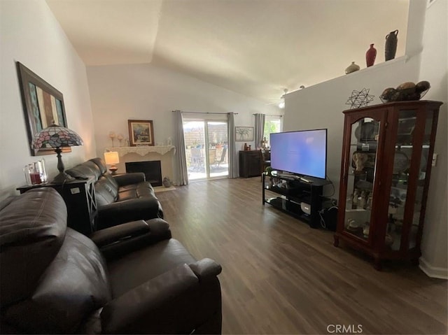 6720 Shaded Wood Pl, Rancho Cucamonga, CA 91701 - living area with wood finished floors, lofted ceiling, and a fireplace