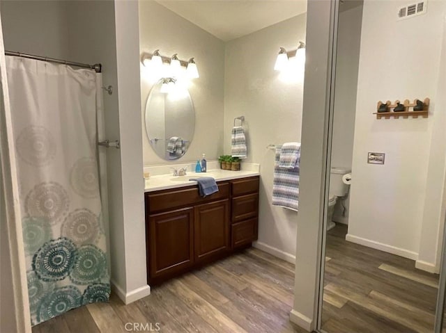 6720 Shaded Wood Pl, Rancho Cucamonga, CA 91701 - full bath with wood finished floors and vanity