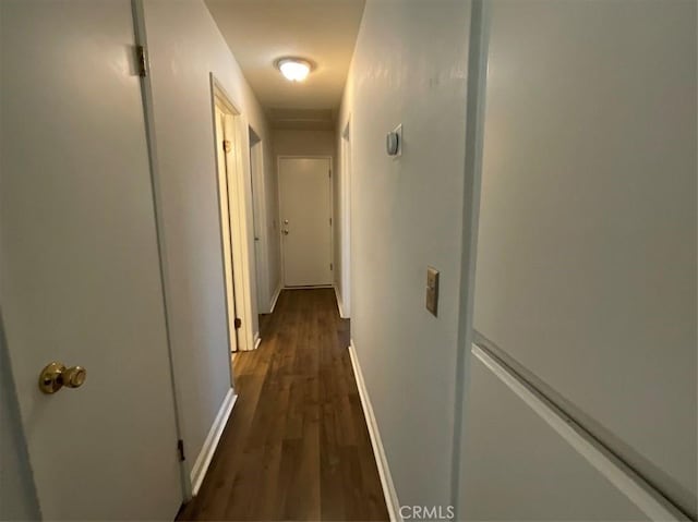 6720 Shaded Wood Pl, Rancho Cucamonga, CA 91701 - hall featuring dark wood-style flooring and baseboards