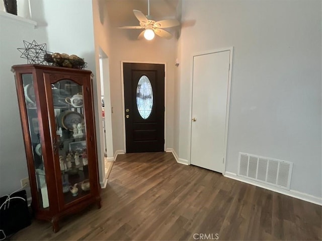 6720 Shaded Wood Pl, Rancho Cucamonga, CA 91701 - foyer with dark wood-style floors, a ceiling fan, and a towering ceiling