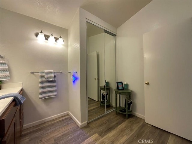 6720 Shaded Wood Pl, Rancho Cucamonga, CA 91701 - bathroom featuring wood finished floors and vanity