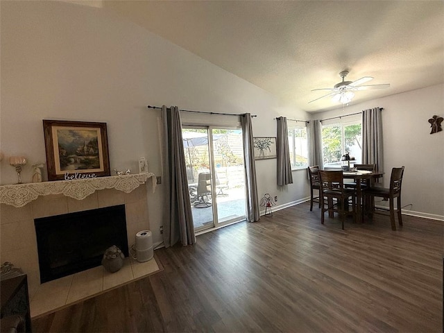 6720 Shaded Wood Pl, Rancho Cucamonga, CA 91701 - dining area featuring wood finished floors, ceiling fan, lofted ceiling, and a tile fireplace