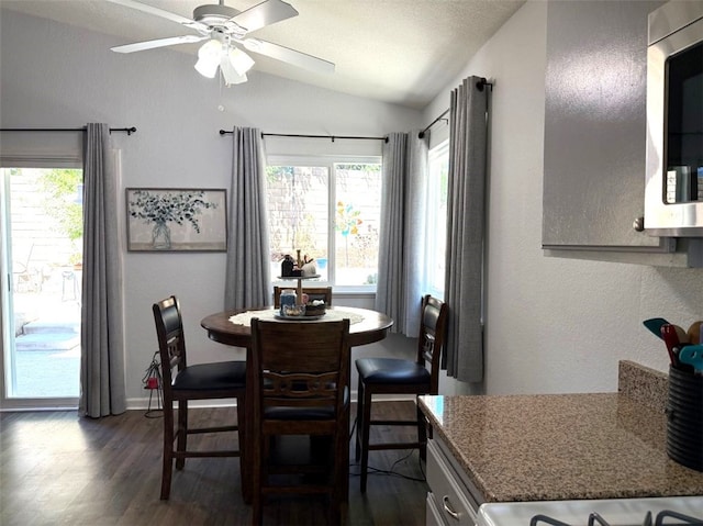 6720 Shaded Wood Pl, Rancho Cucamonga, CA 91701 - dining area with lofted ceiling, dark wood-type flooring, and a ceiling fan