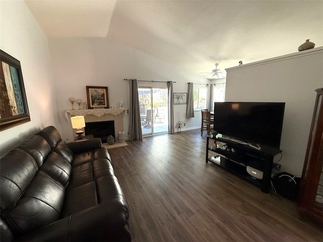 6720 Shaded Wood Pl, Rancho Cucamonga, CA 91701 - living area with lofted ceiling, ceiling fan, dark wood finished floors, and a fireplace with flush hearth