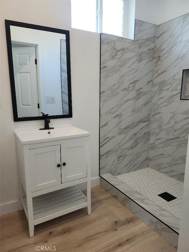 10531 Alexander Ave, South Gate, CA 90280 - bathroom with vanity, a shower stall, and wood finished floors